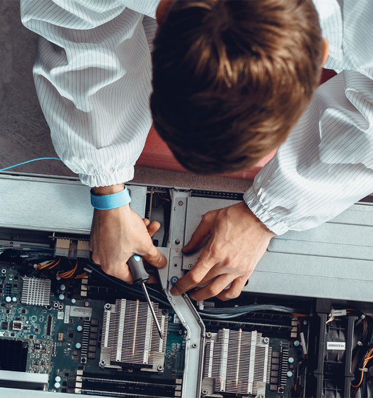 SCIT student repairing computer