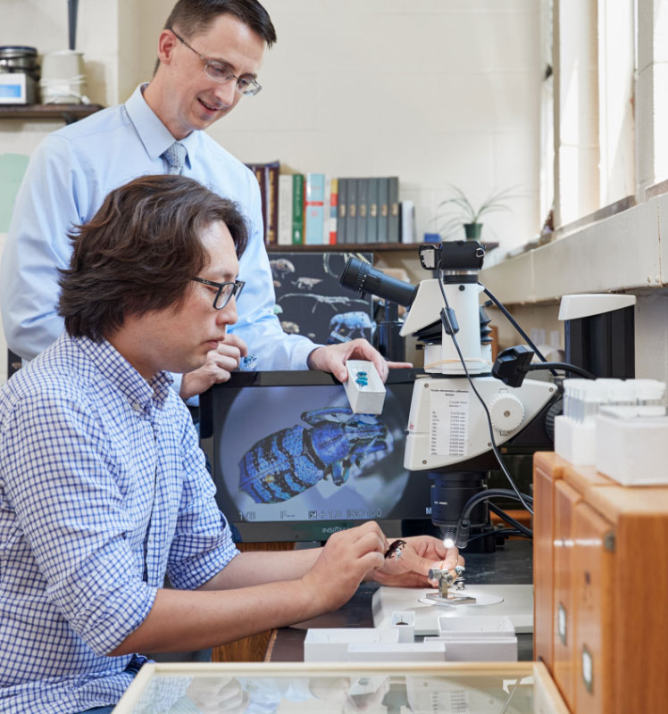 Professor and student in lab