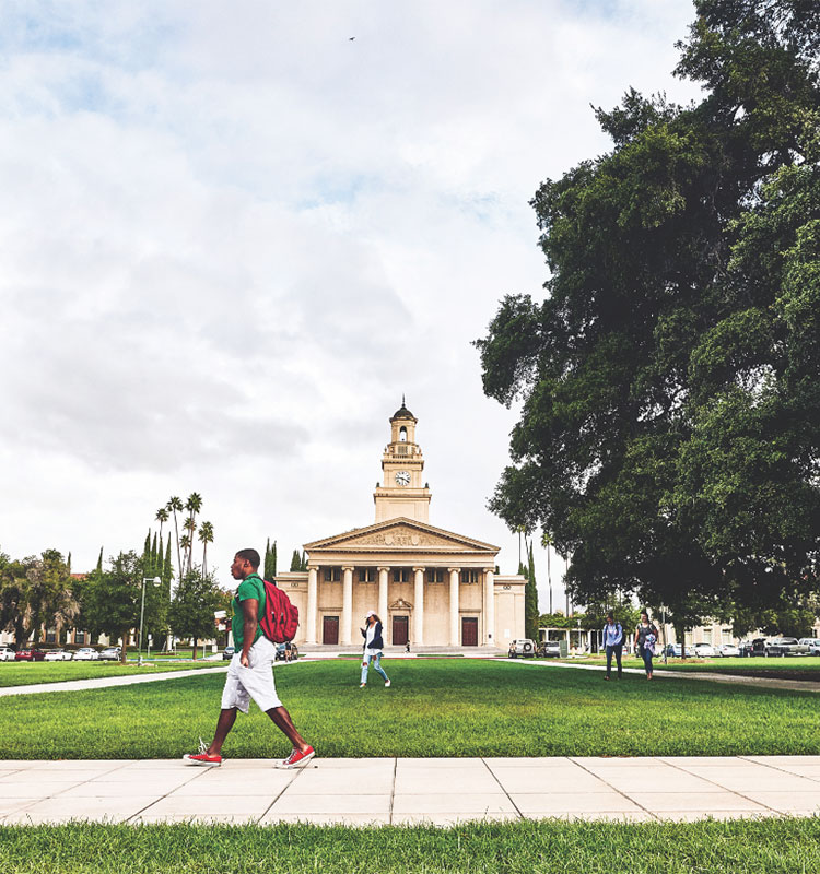 Student walking across campus